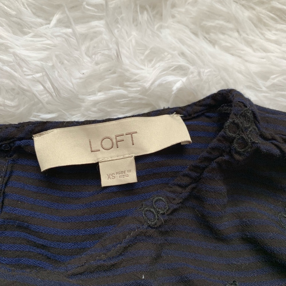 Blue blouse with black stripes